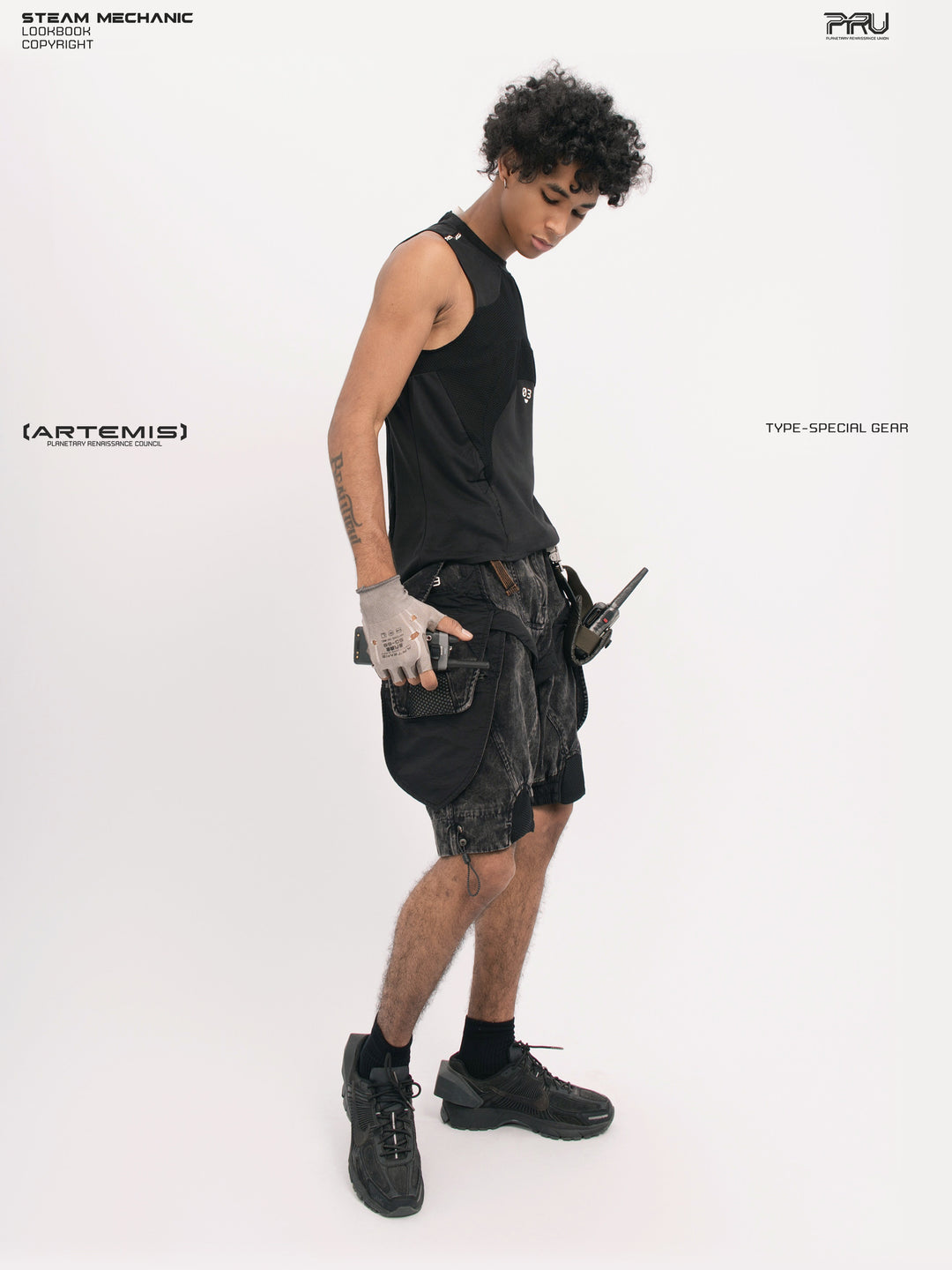 ARTEMIS blackbird black detachable technical shorts — side-front full-outfit view showing the cargo-pocket profile