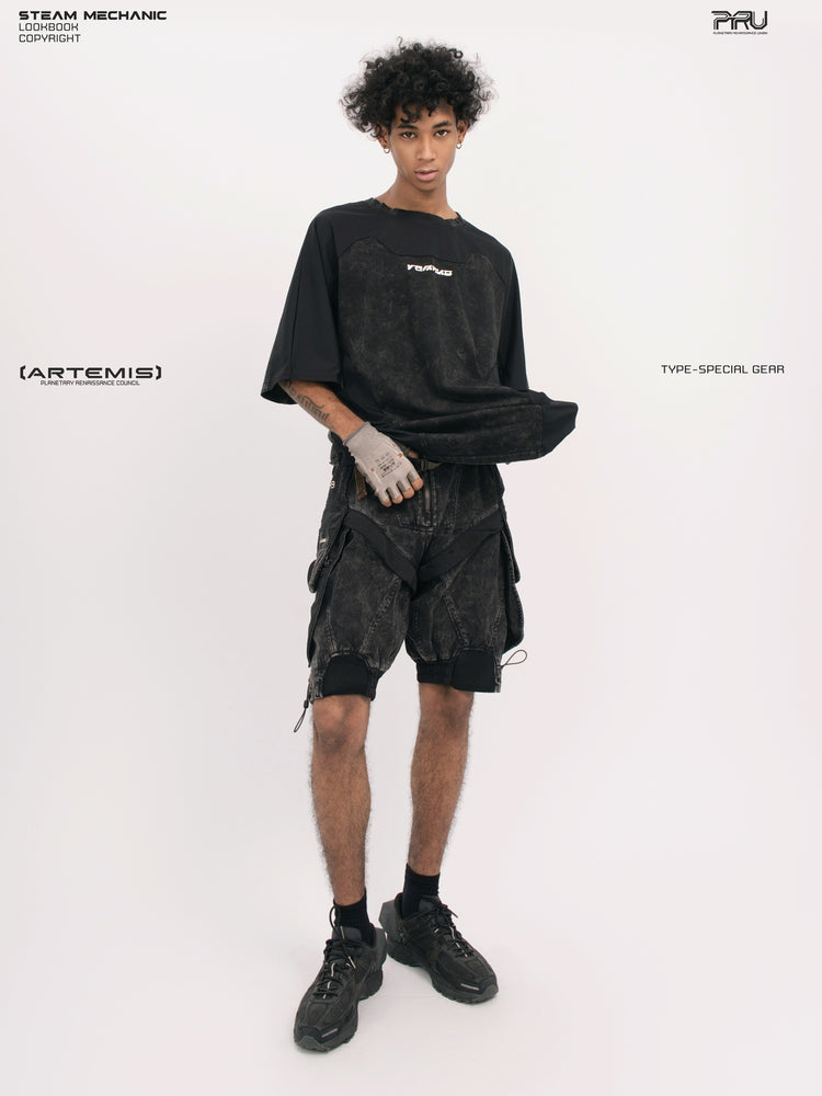 ARTEMIS blackbird black detachable technical shorts — front full-outfit view with the tee lifted to show the waist