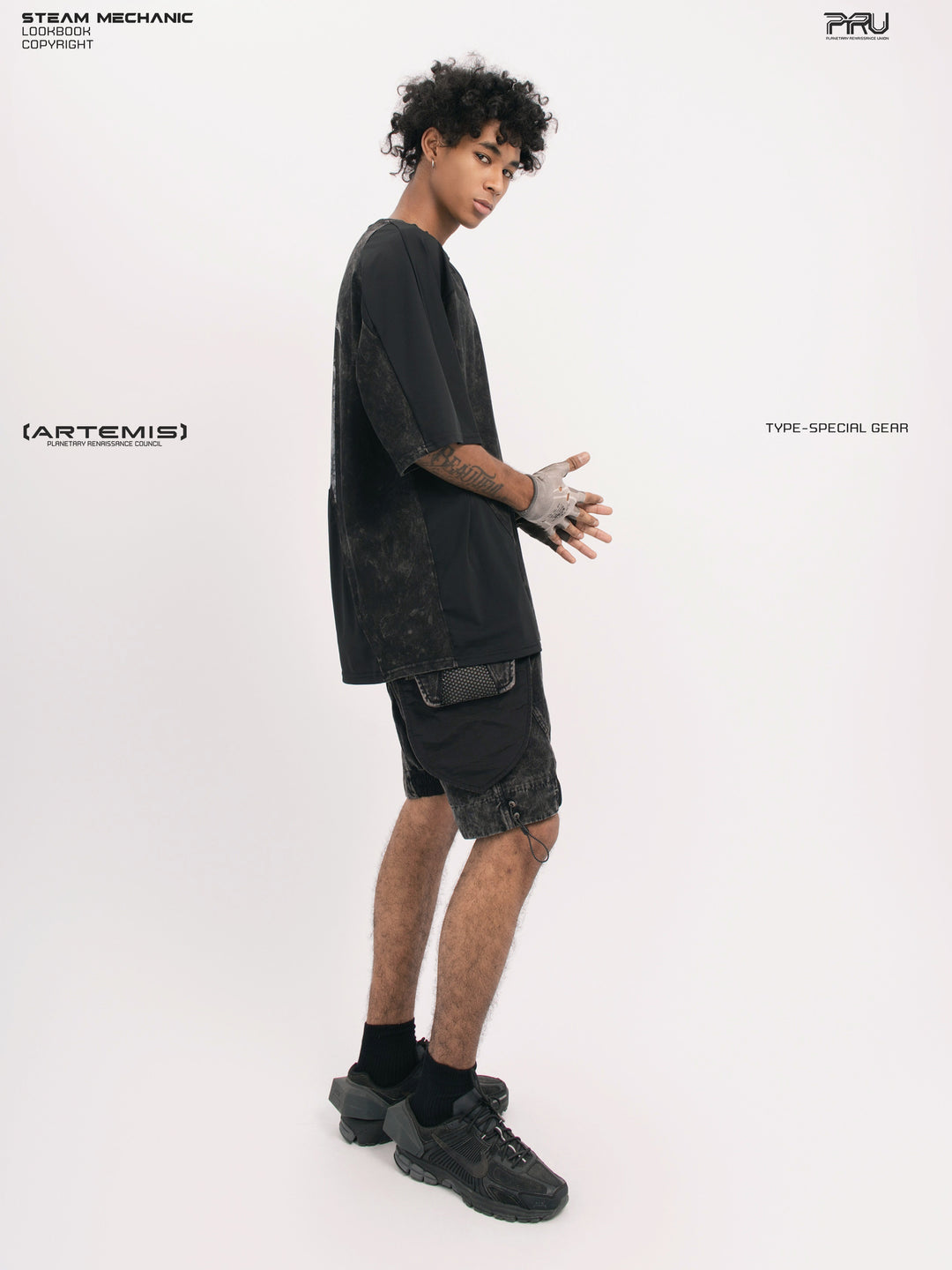 ARTEMIS blackbird black detachable technical shorts — side full-outfit view showing the pocket depth