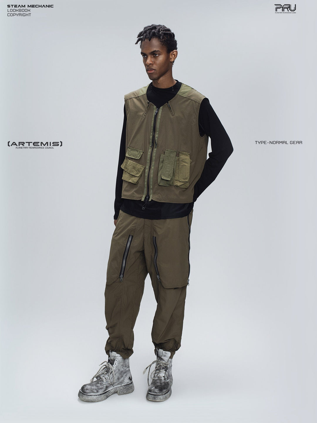 GAIA curved-blade technical pants in stone green — full-length modeled three-quarter view with matching vest styling