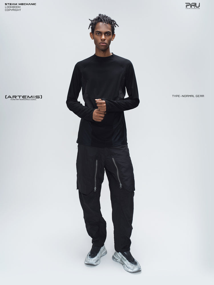GAIA black curved-blade technical pants — full-length modeled view with a black base layer