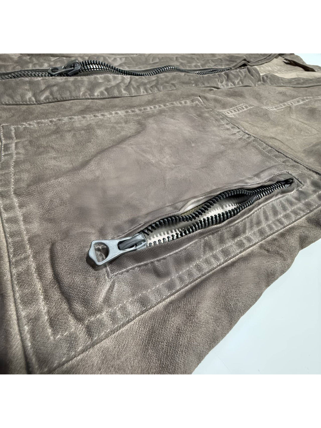 GAIA gravel brown open-collar technical robe — gravel brown zip pocket and seam construction close-up