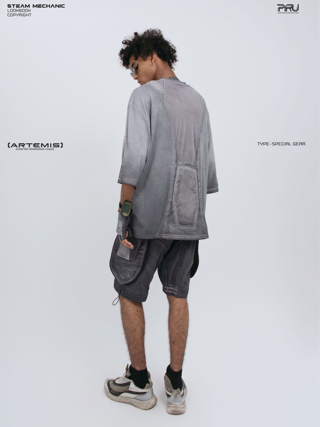 STARCORE stellar blue distressed mesh tee — full-length modeled rear three-quarter view from the opposite side