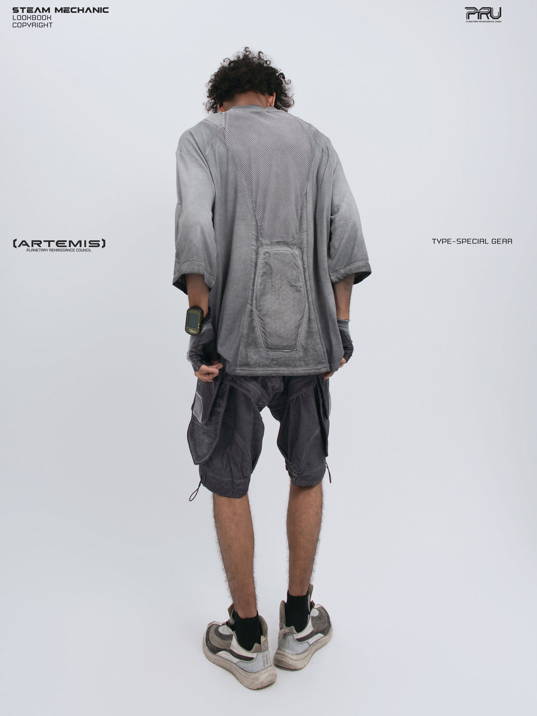 STARCORE moon dust gray distressed mesh tee — full-length modeled back view holding the hem