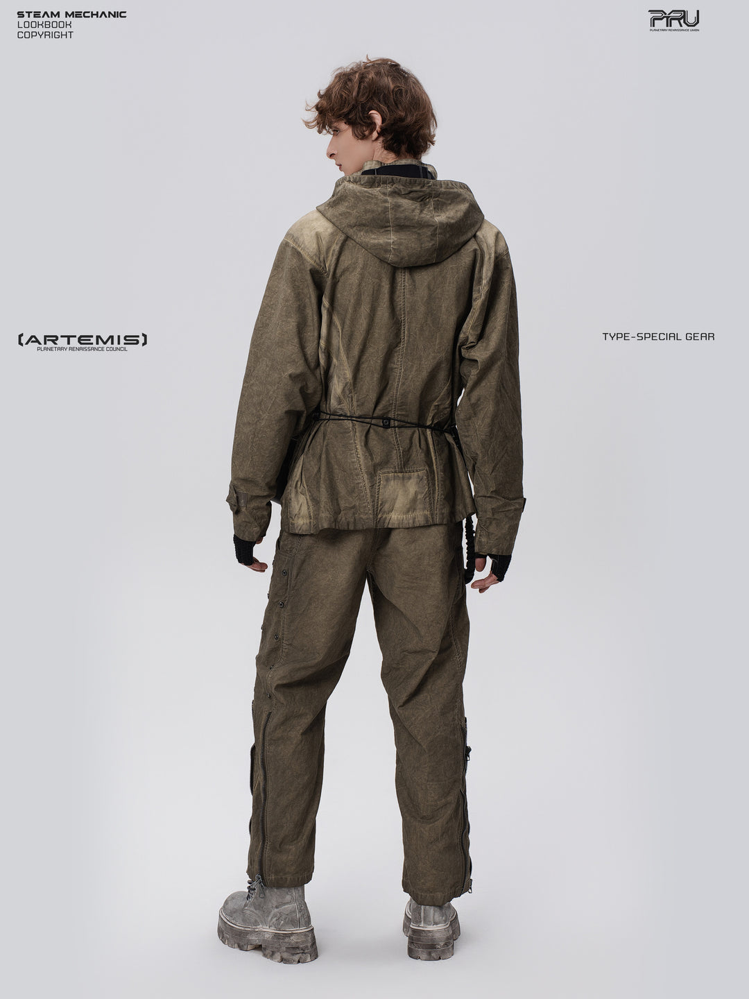 STARCORE distressed work jacket in lunar soil green — full-length rear three-quarter modeled view