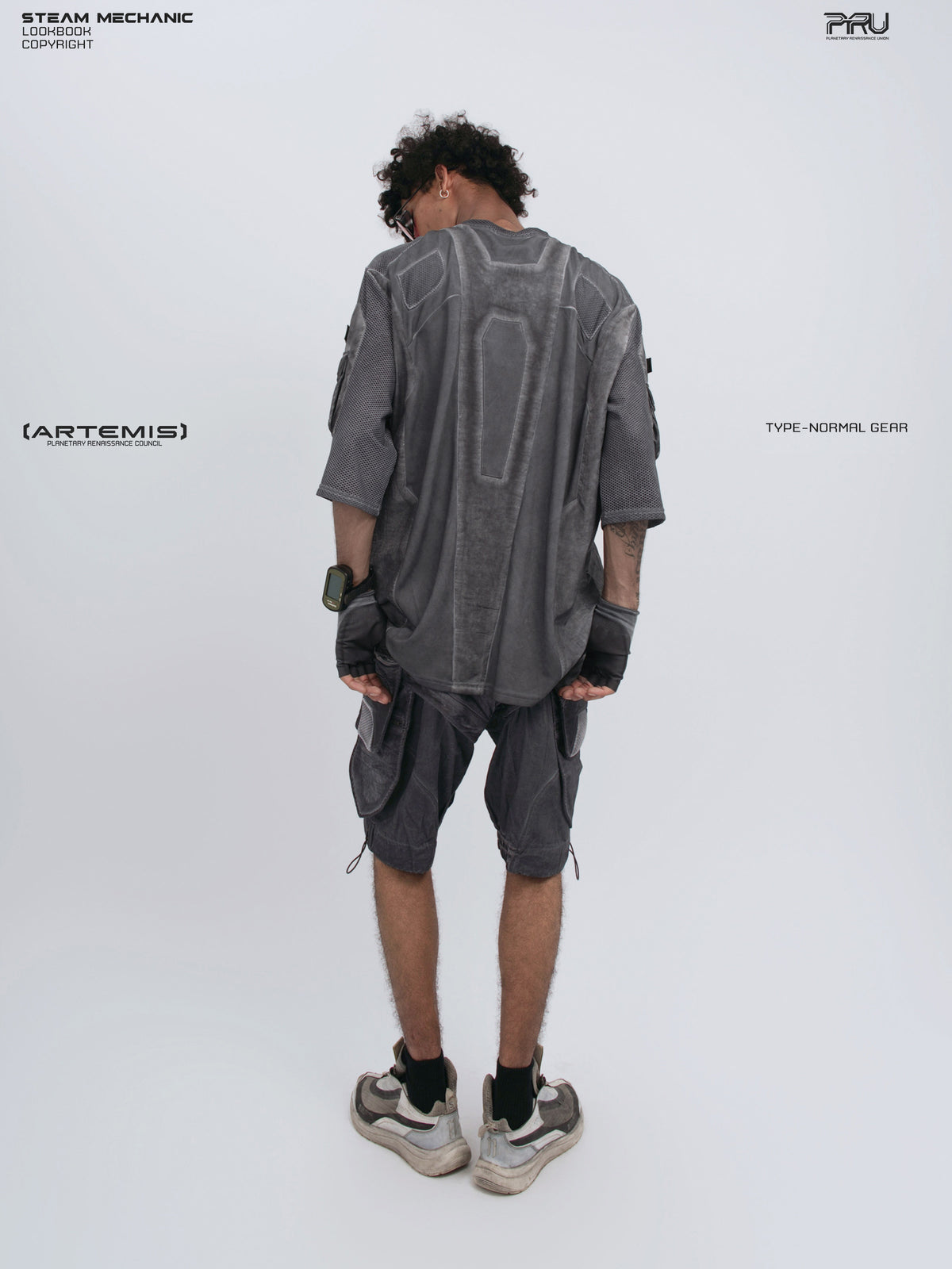 STARCORE moon dust gray velcro mesh tee — full-length modeled rear view holding the hem