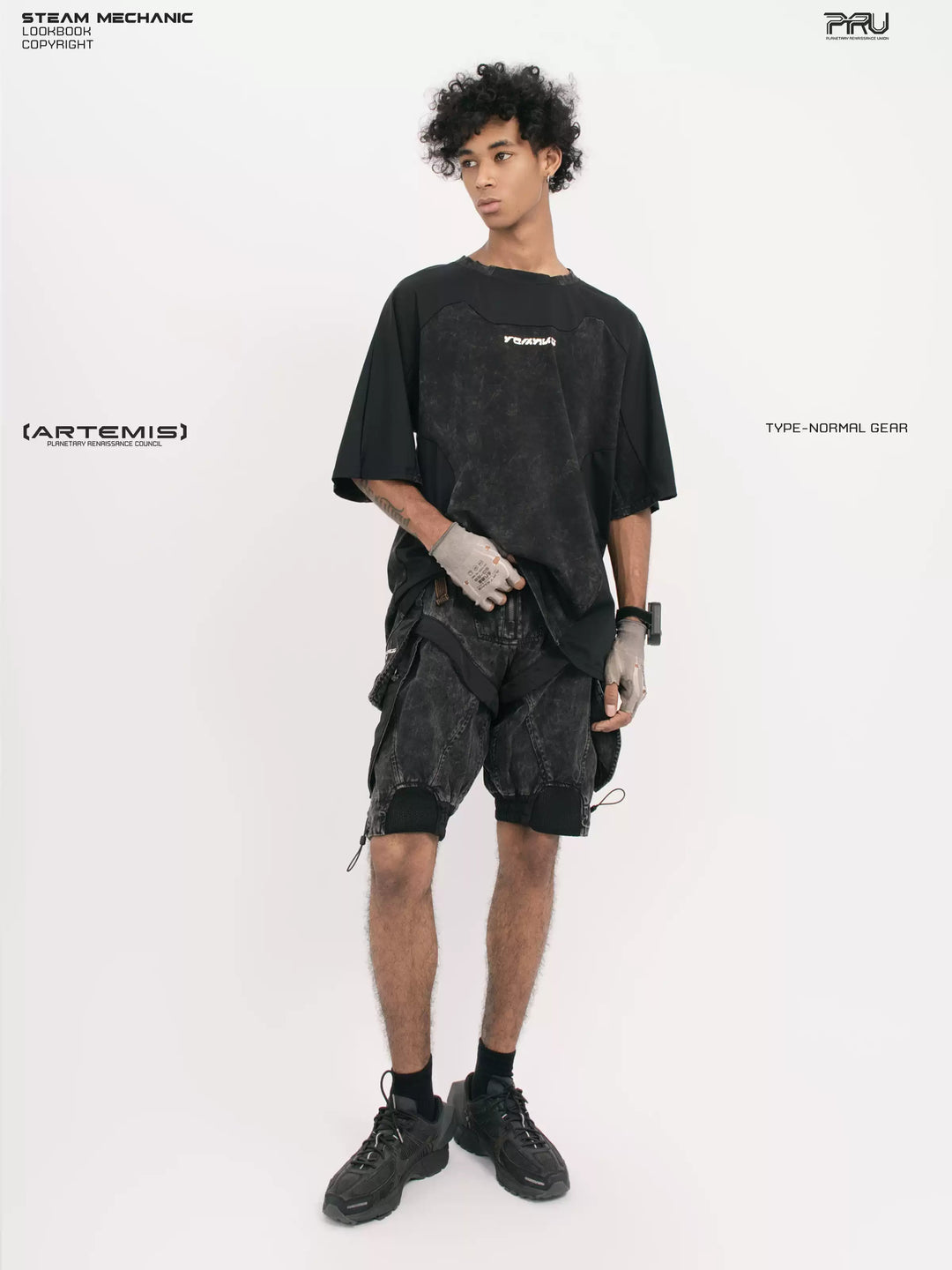 STARCORE black tortoise velcro mesh tee — full-length angled front modeled view with one hand at the hem