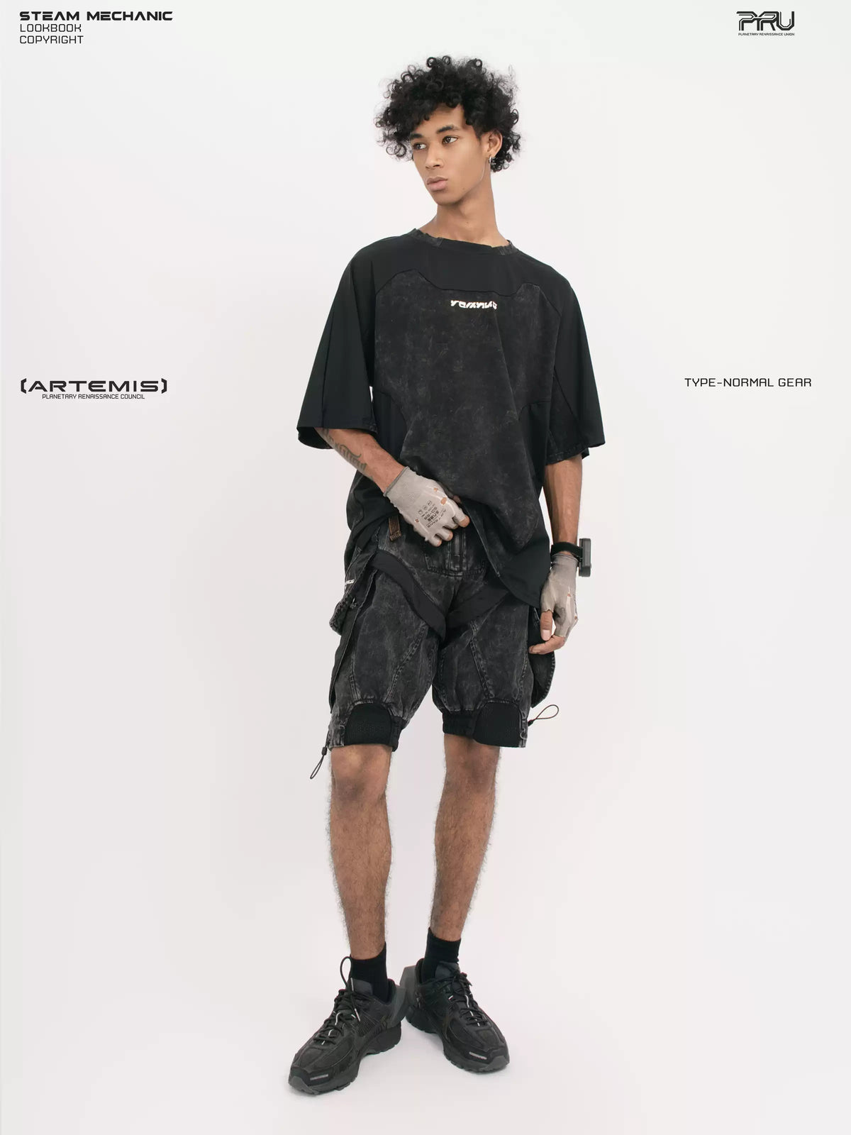 STARCORE black tortoise velcro mesh tee — full-length angled front modeled view with one hand at the hem