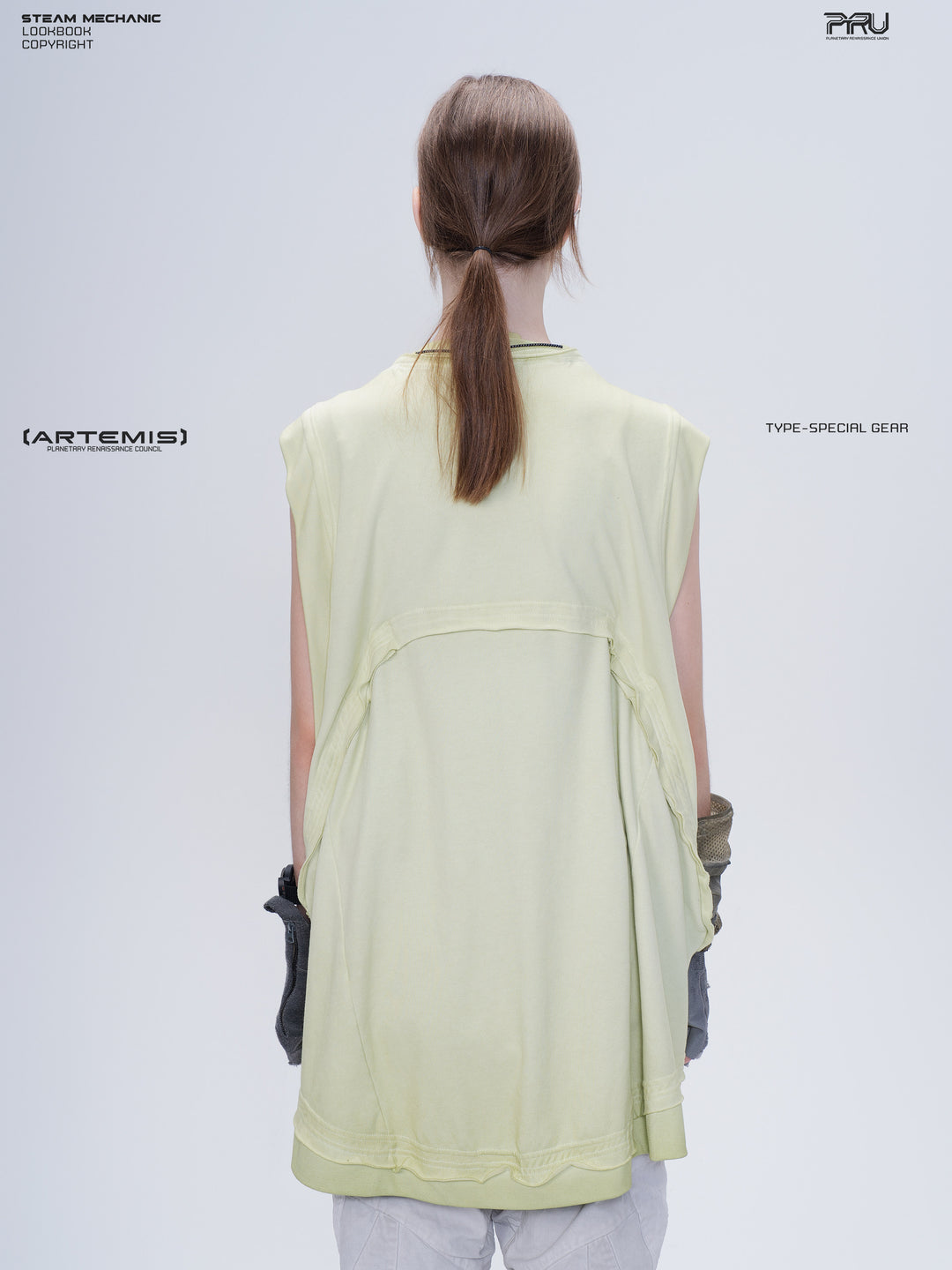 SUPERNOVA convertible drawstring technical tee — nebula green modeled back view showing the layered convertible panel