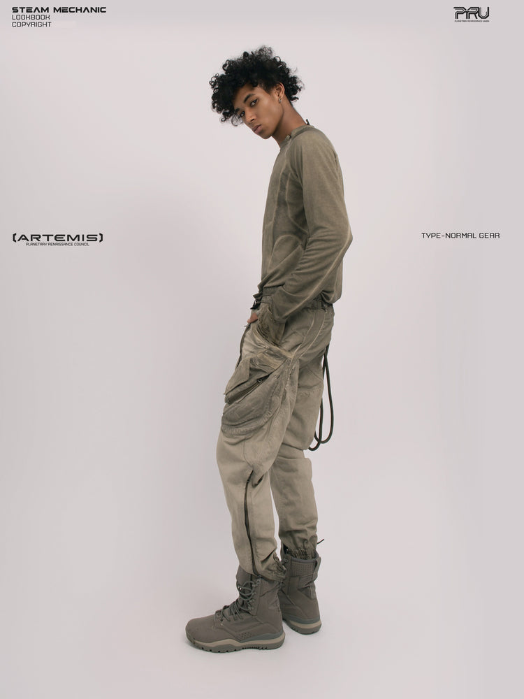 AEGIS lunar soil teal multi-pocket moto pants — full-length left-side modeled view showing the cargo pocket and calf zipper