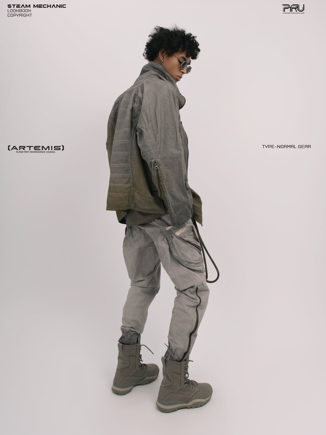 AEGIS lunar sea gray multi-pocket moto pants — full-length rear three-quarter modeled view with a coordinating jacket