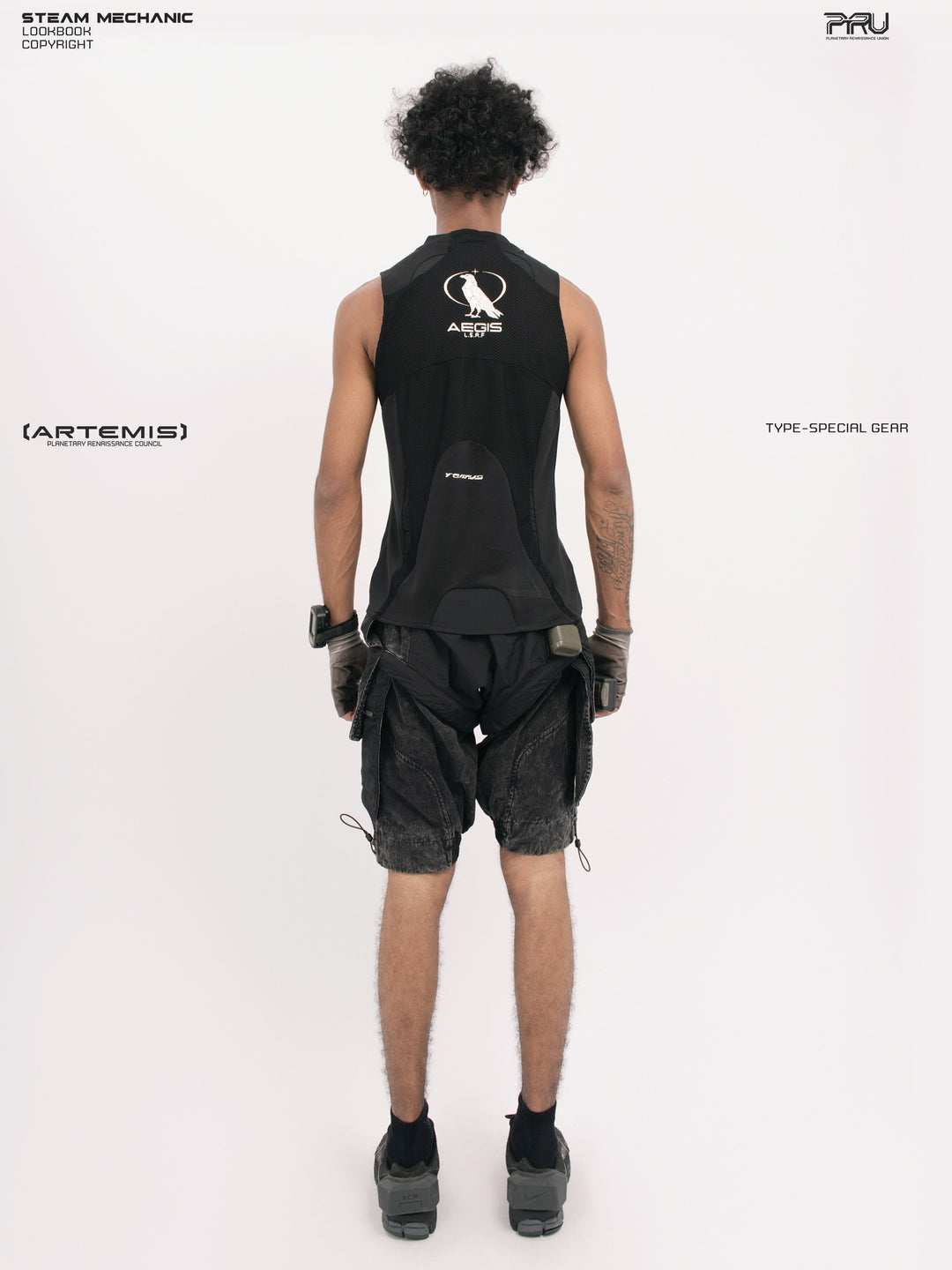 AEGIS blackbird black distressed mesh tank — full-length back modeled view showing the AEGIS emblem and shaped rear panel