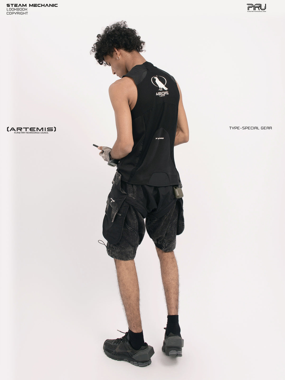 AEGIS blackbird black distressed mesh tank — opposite three-quarter back modeled view showing the shaped hem