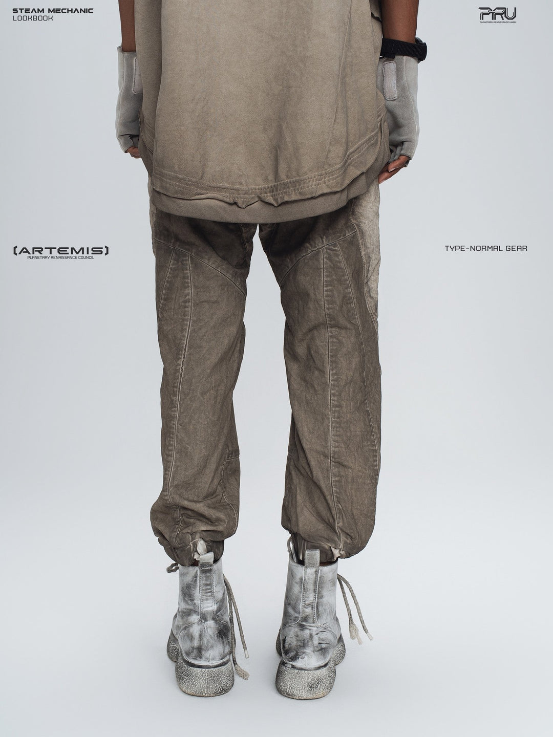 AEGIS cropped moto riding pants in mercury brown — back modeled view showing the reinforced seat and cuffs