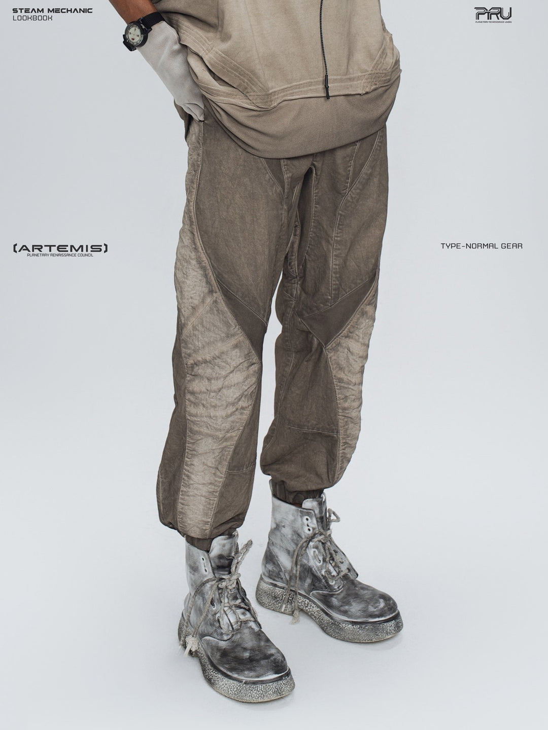 AEGIS cropped moto riding pants in mercury brown — side modeled detail showing the curved outer-leg panels