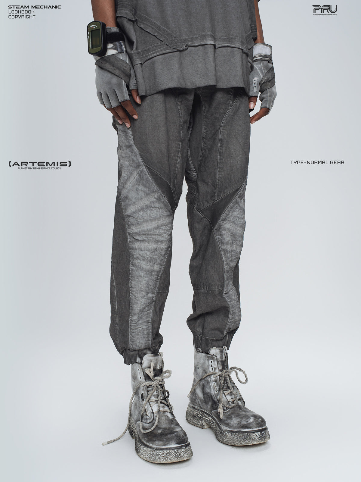 AEGIS moon dust gray cropped moto riding pants — three-quarter modeled view of the washed gray panel construction