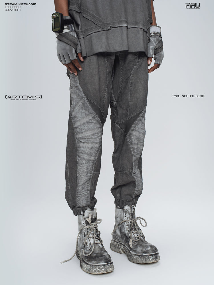 AEGIS moon dust gray cropped moto riding pants — three-quarter modeled view of the washed gray panel construction