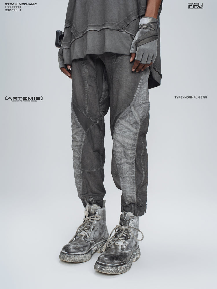 AEGIS moon dust gray cropped moto riding pants — opposite three-quarter modeled view showing the curved leg seams