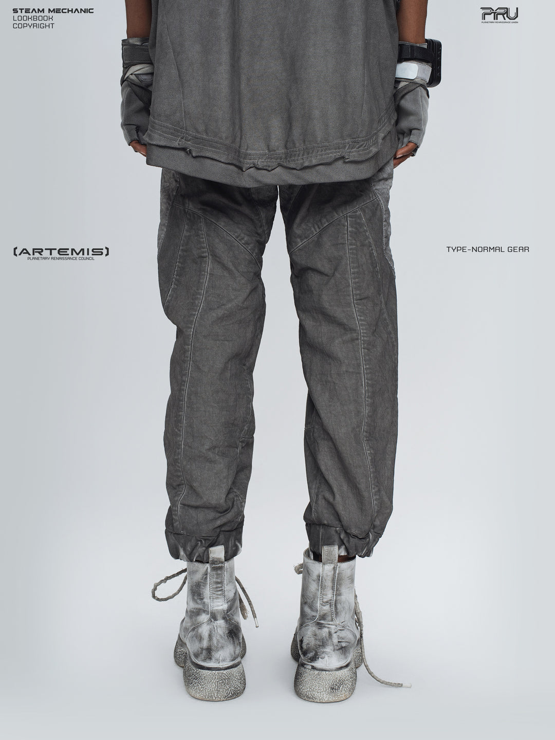 AEGIS moon dust gray cropped moto riding pants — back modeled view with cropped elasticated cuffs