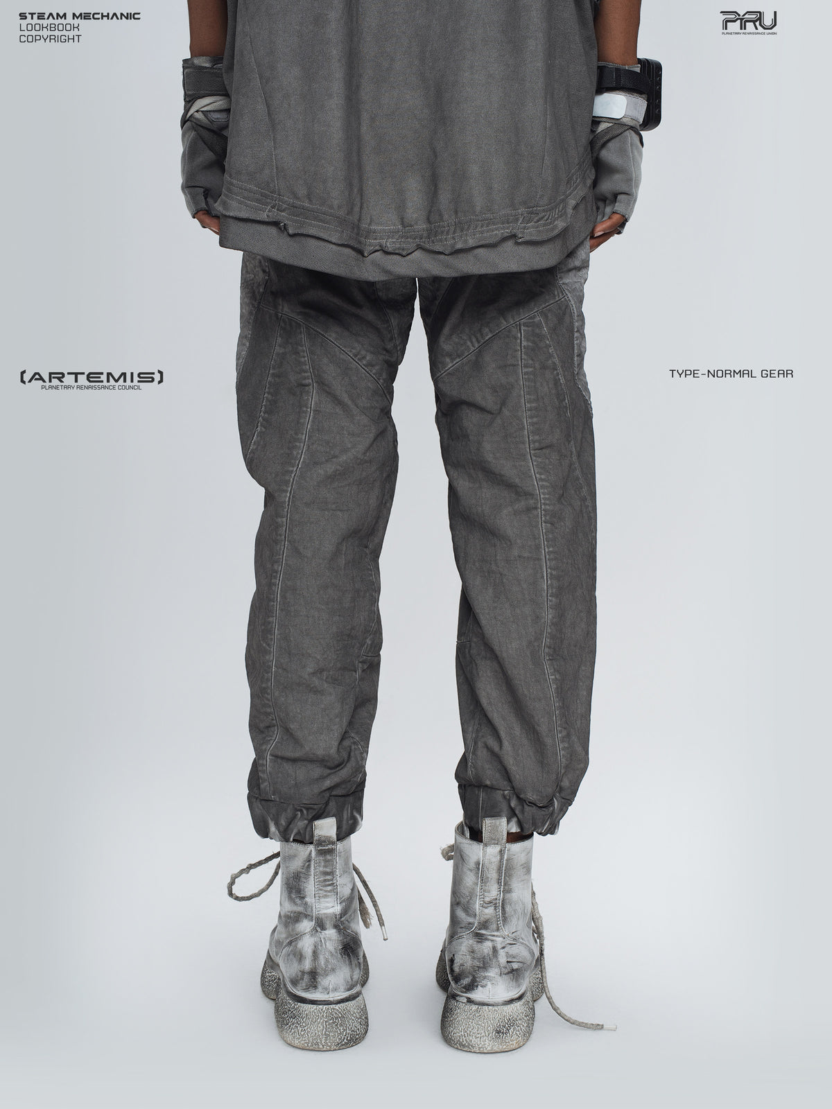 AEGIS moon dust gray cropped moto riding pants — back modeled view with cropped elasticated cuffs