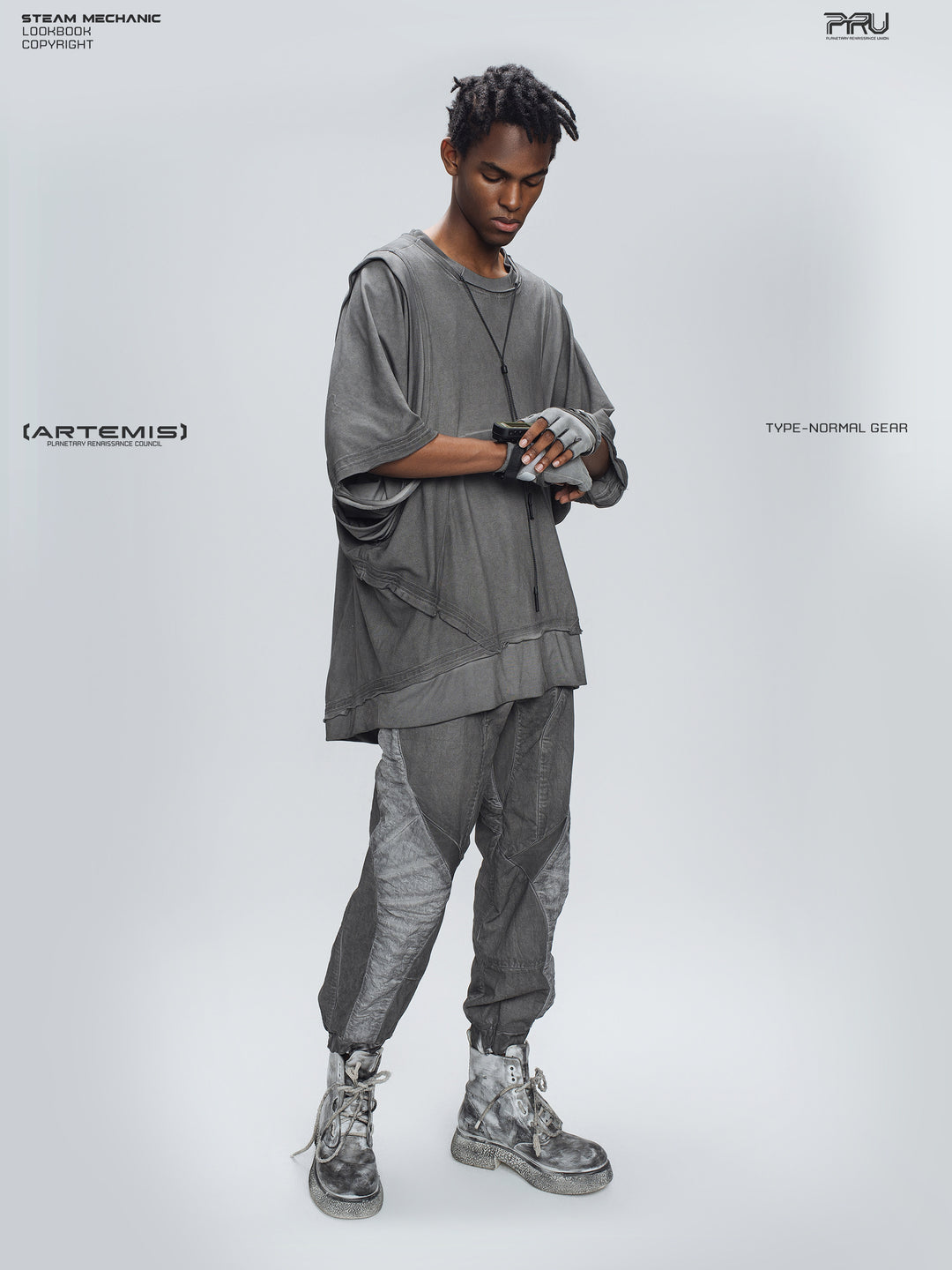 AEGIS moon dust gray cropped moto riding pants — full-body three-quarter modeled view with hands crossed