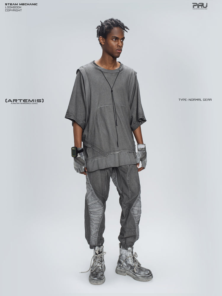 AEGIS moon dust gray cropped moto riding pants — full-body angled modeled view with arms lowered