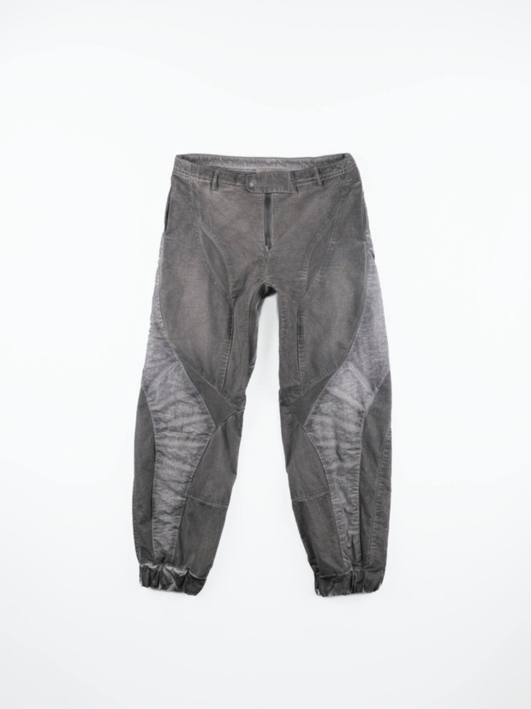 AEGIS moon dust gray cropped moto riding pants — front flat-lay showing angular washed gray panels and gathered cuffs