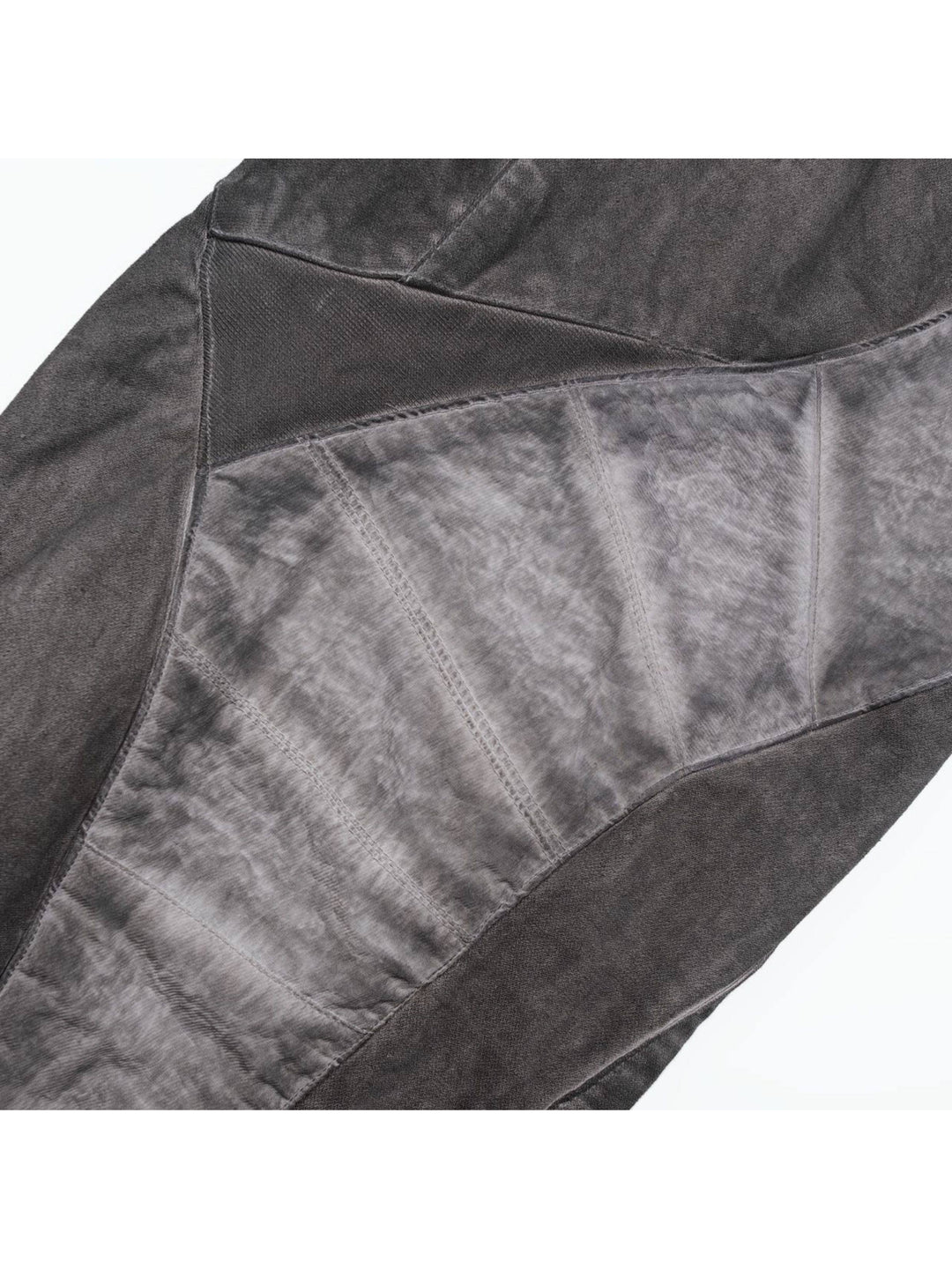 AEGIS moon dust gray cropped moto riding pants — close-up of the washed gray fabric and intersecting panel seams