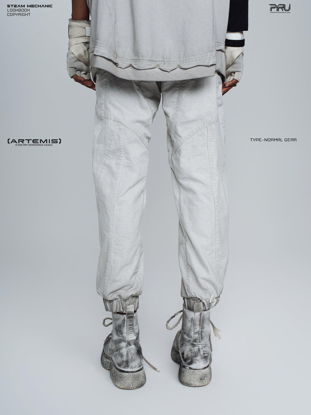 AEGIS eris white cropped moto riding pants — back modeled view with gathered cuffs