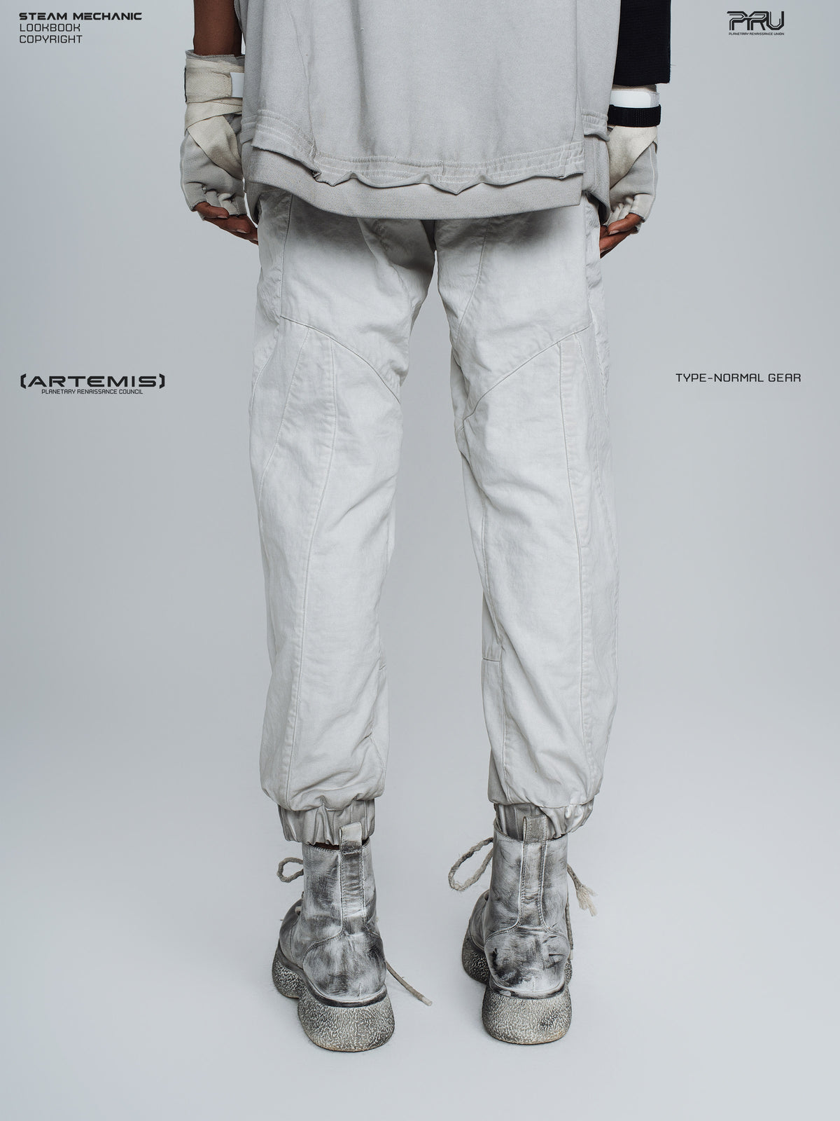 AEGIS eris white cropped moto riding pants — back modeled view with gathered cuffs
