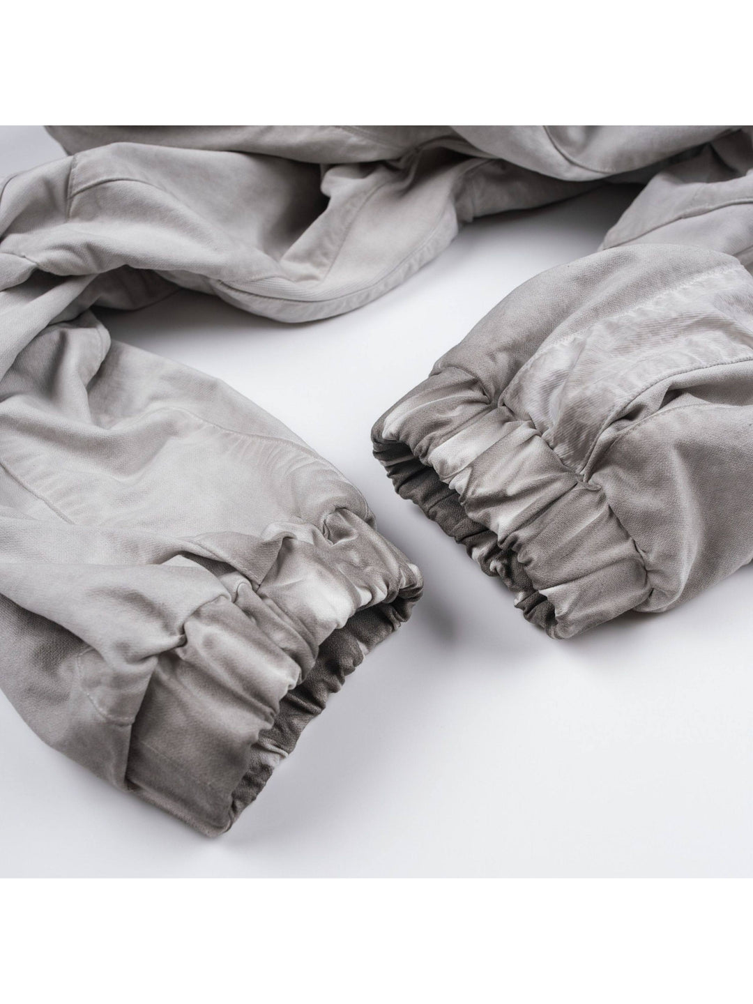 AEGIS eris white cropped moto riding pants — close-up of the gathered elasticated cuffs