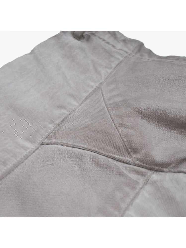 AEGIS eris white cropped moto riding pants — close-up of contrasting fabric panels and stitching
