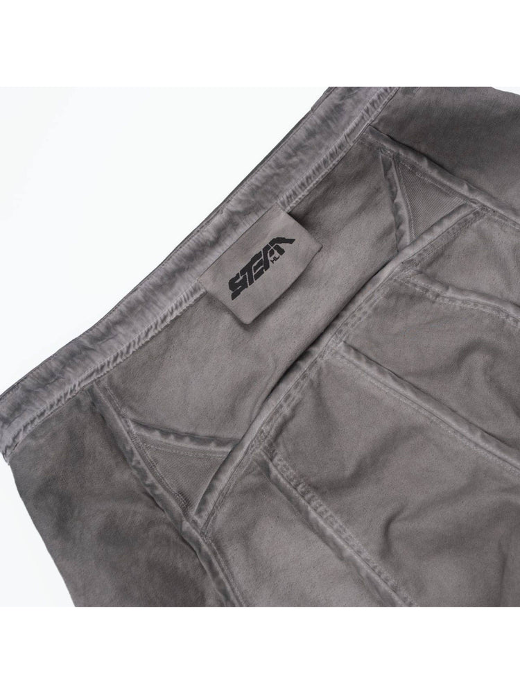 AEGIS eris white cropped moto riding pants — inside waistband detail showing the sewn STEAM brand label