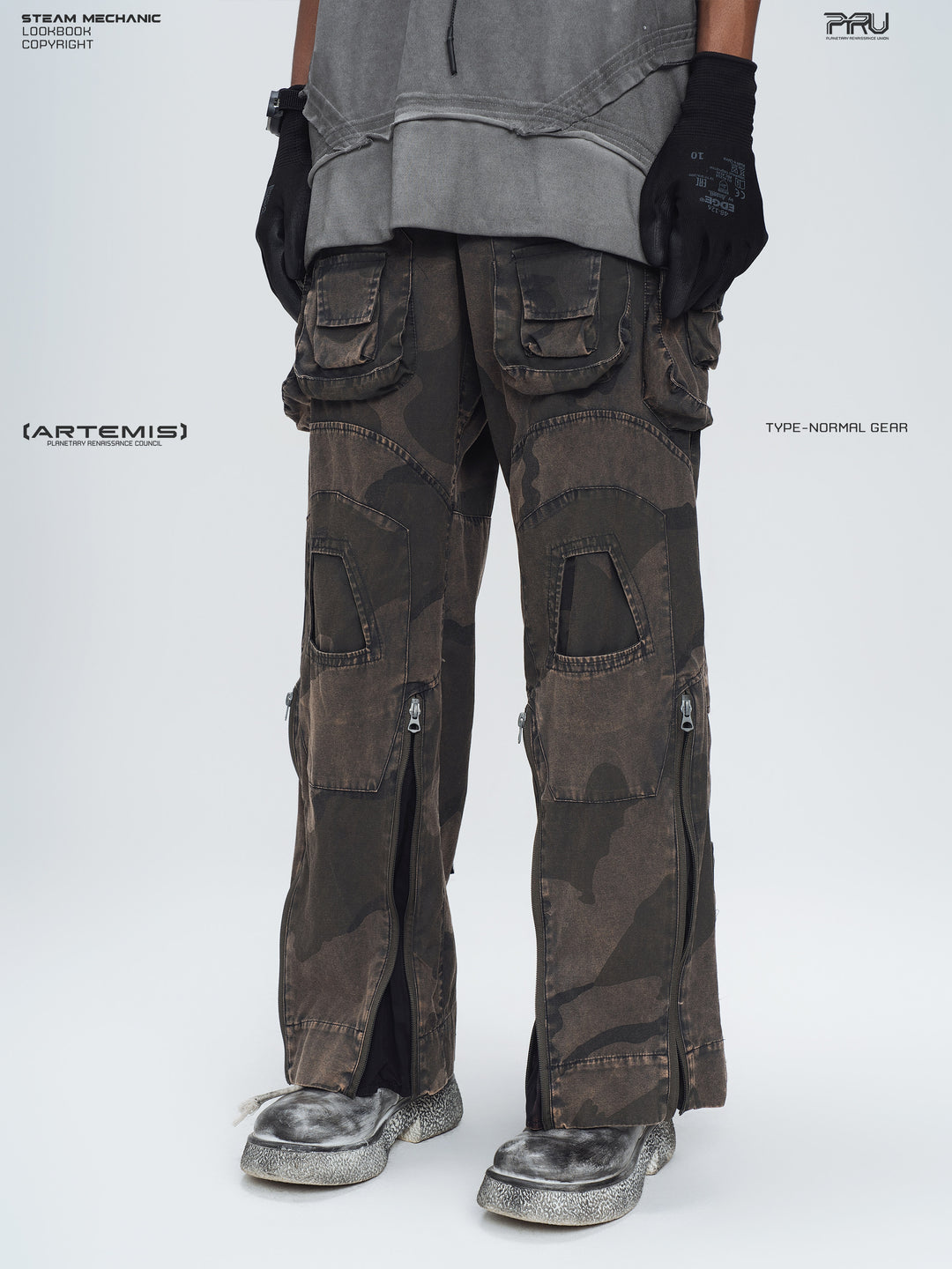 IXION dead leaf brown washed camouflage combat pants — opposite three-quarter front lower-body modeled view