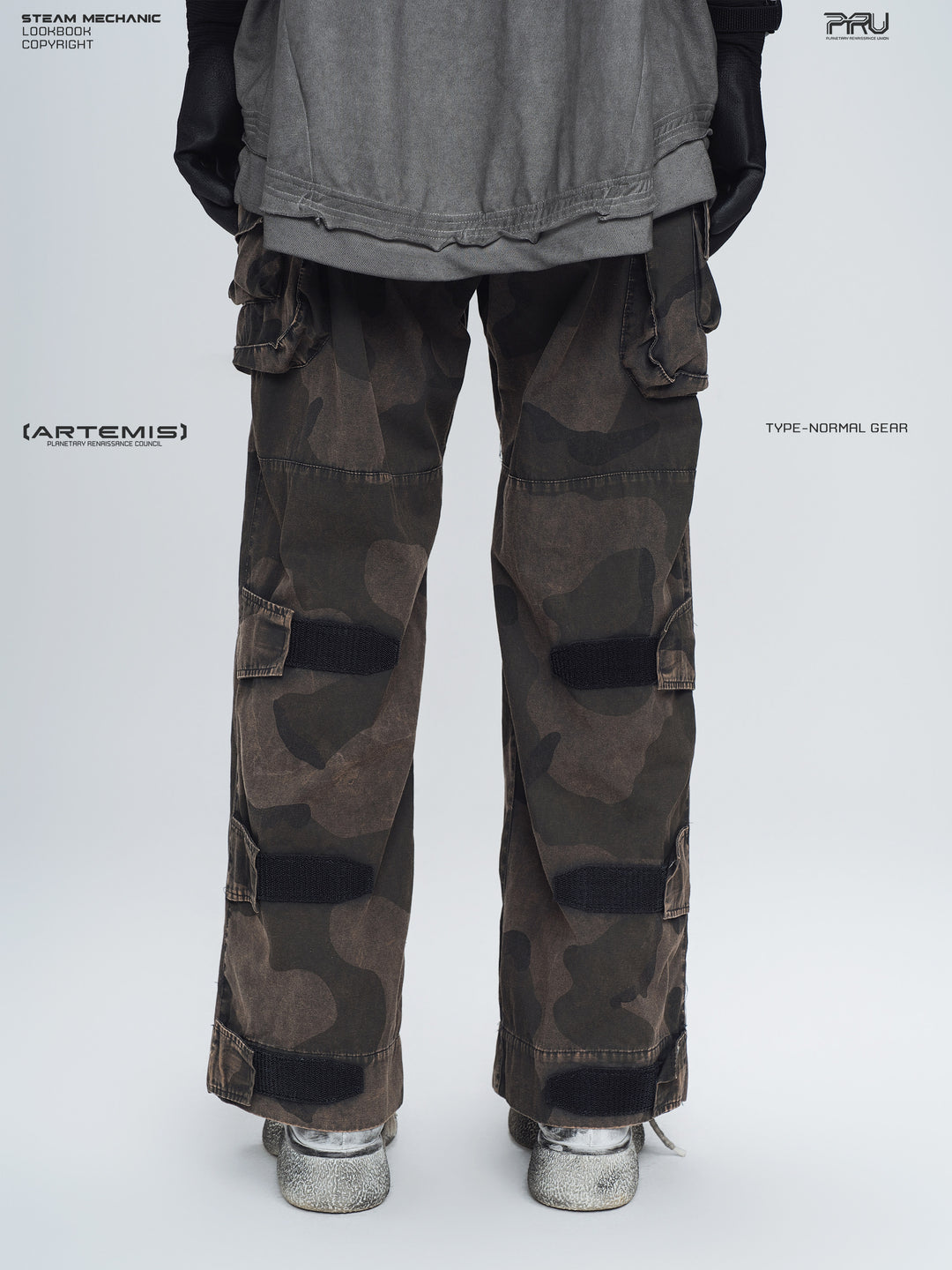 IXION dead leaf brown washed camouflage combat pants — back lower-body modeled view showing adjustable leg straps