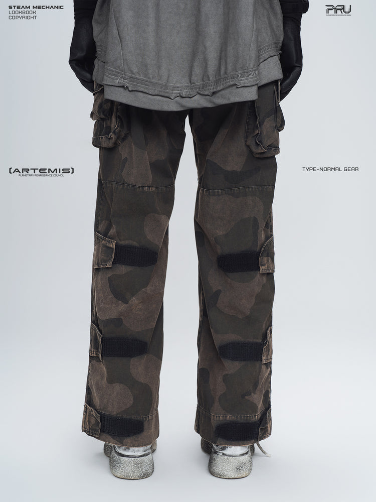 IXION dead leaf brown washed camouflage combat pants — back lower-body modeled view showing adjustable leg straps