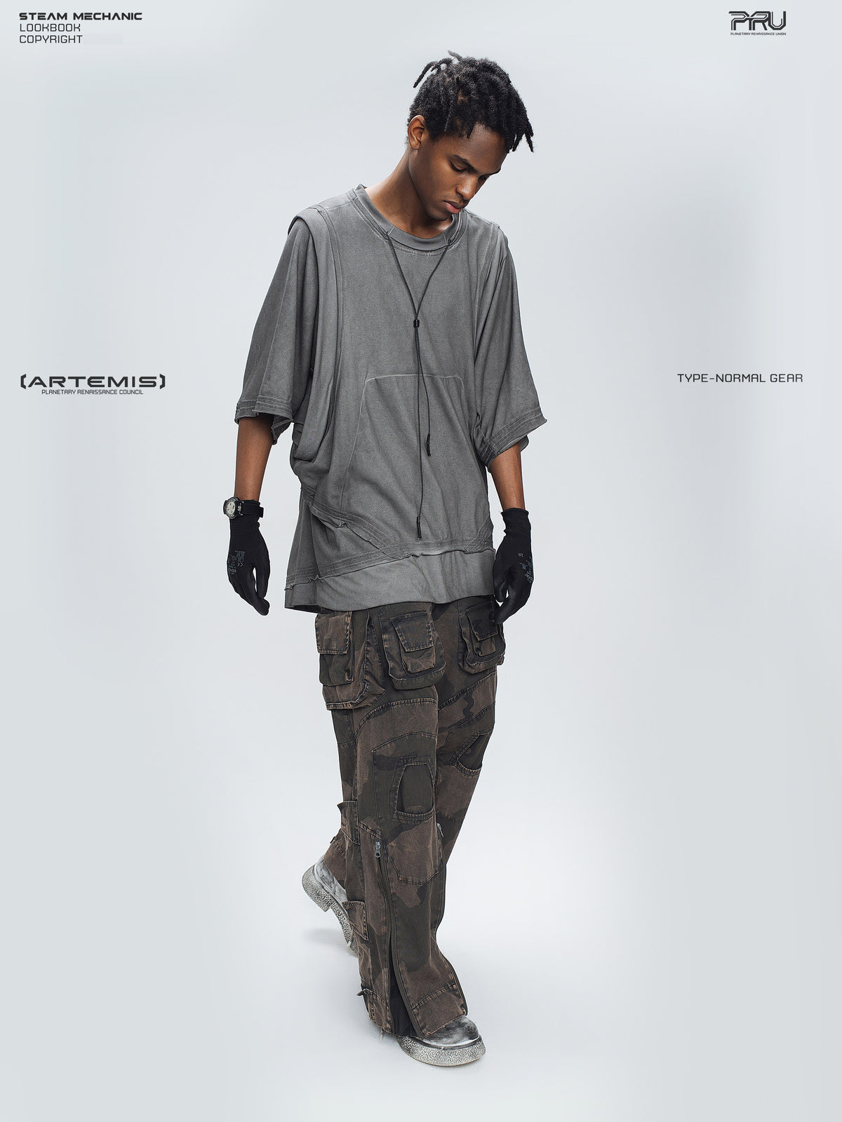 IXION dead leaf brown washed camouflage combat pants — full-length three-quarter modeled view looking down