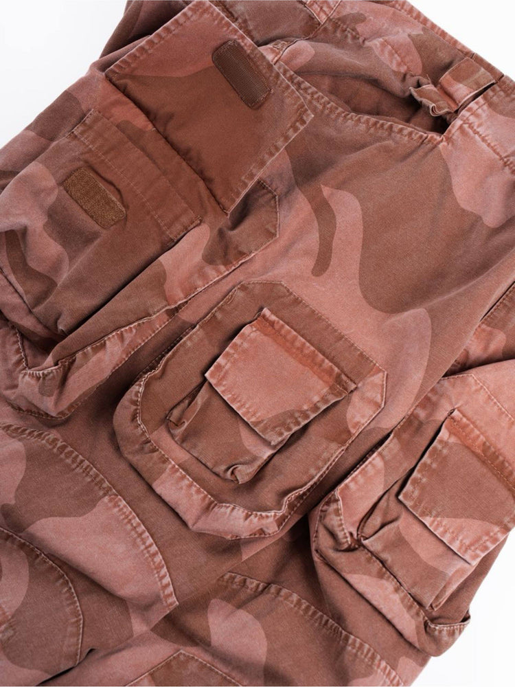 IXION washed camouflage combat pants in dune red — close-up of upper cargo pockets with flap opened