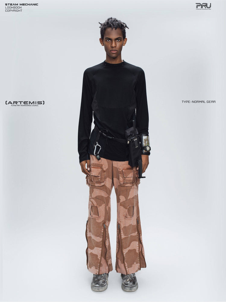 IXION washed camouflage combat pants in dune red — full-length modeled front view