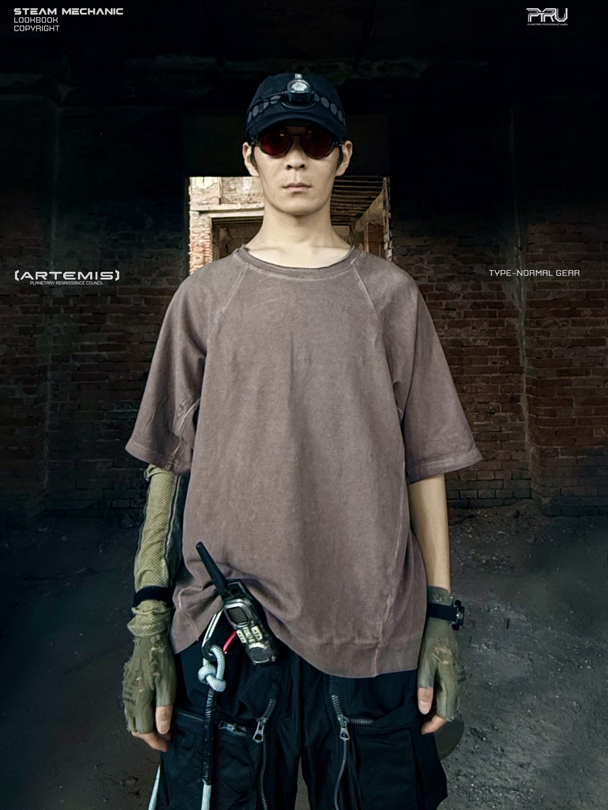 ERODED SPINE distressed asymmetric tee in wasteland vine brown — front modeled view showing the washed finish