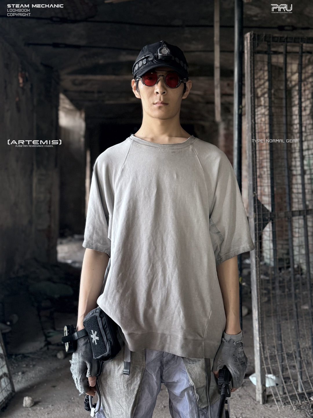 ERODED SPINE distressed asymmetric tee in oxidized white — front modeled view showing the gray washed finish