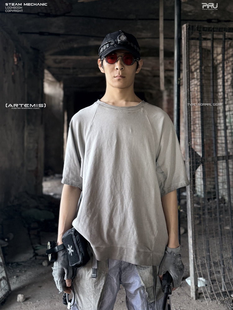 ERODED SPINE distressed asymmetric tee in oxidized white — front modeled view showing the gray washed finish