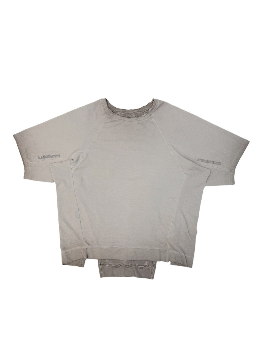 ERODED SPINE distressed asymmetric tee — oxidized white front flat lay showing the gray washed finish and asymmetric hem