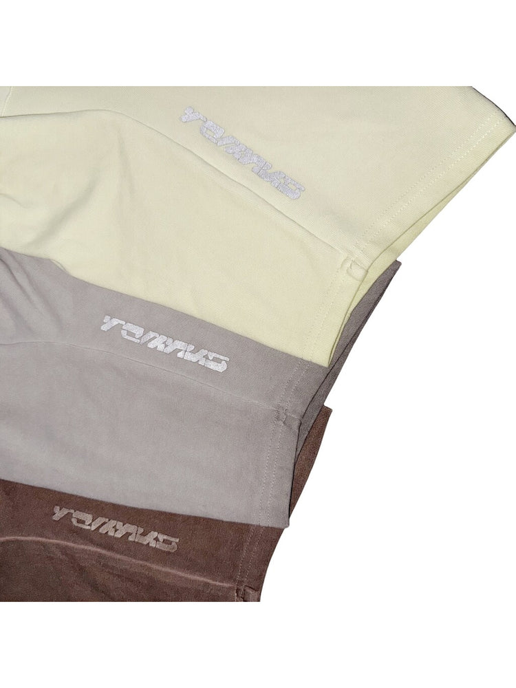 ERODED SPINE distressed asymmetric tee — reflective sleeve logos across all three colors