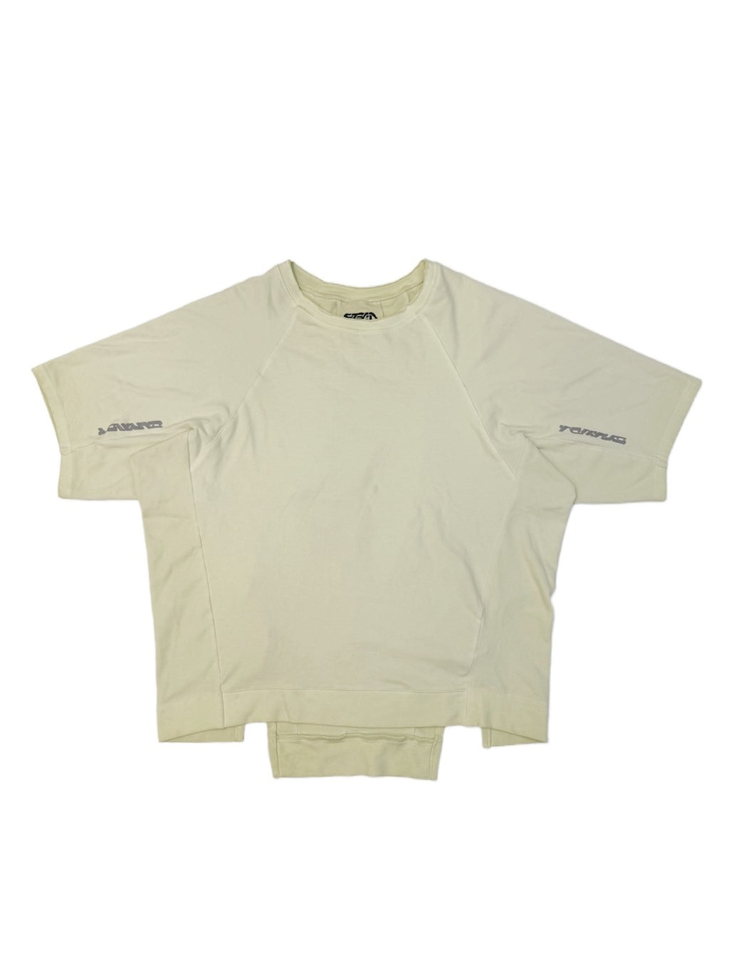 ERODED SPINE distressed asymmetric tee — aurora green front flat lay showing the asymmetric panels