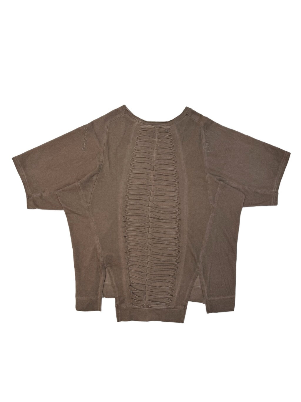 ERODED SPINE distressed asymmetric tee — wasteland vine brown back flat lay showing the spine-like cutouts