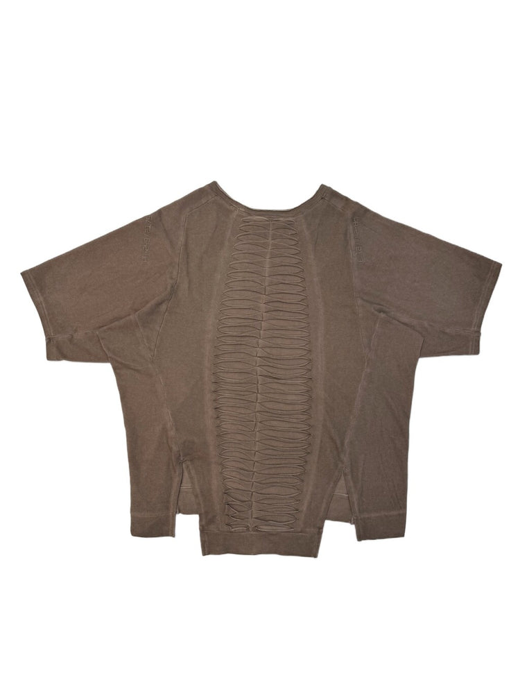 ERODED SPINE distressed asymmetric tee — wasteland vine brown back flat lay showing the spine-like cutouts