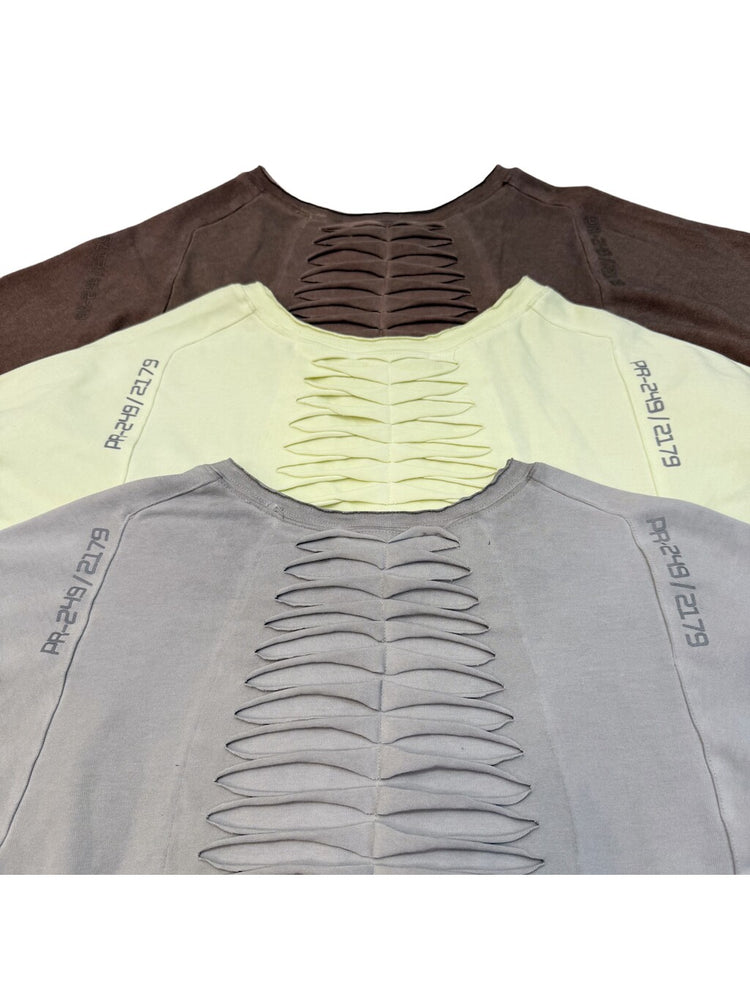 ERODED SPINE distressed asymmetric tee — back neckline cutout details across all three colors
