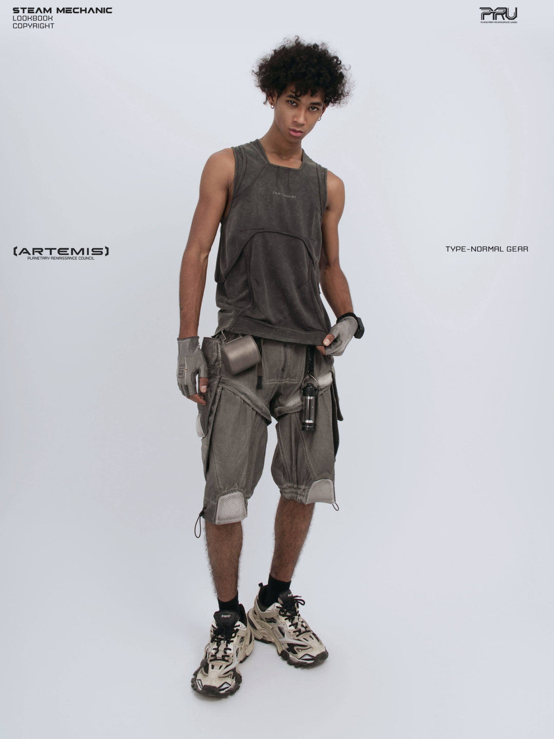 RIFT ARC deconstructed tank in washed gray — full-length front modeled view holding the hem