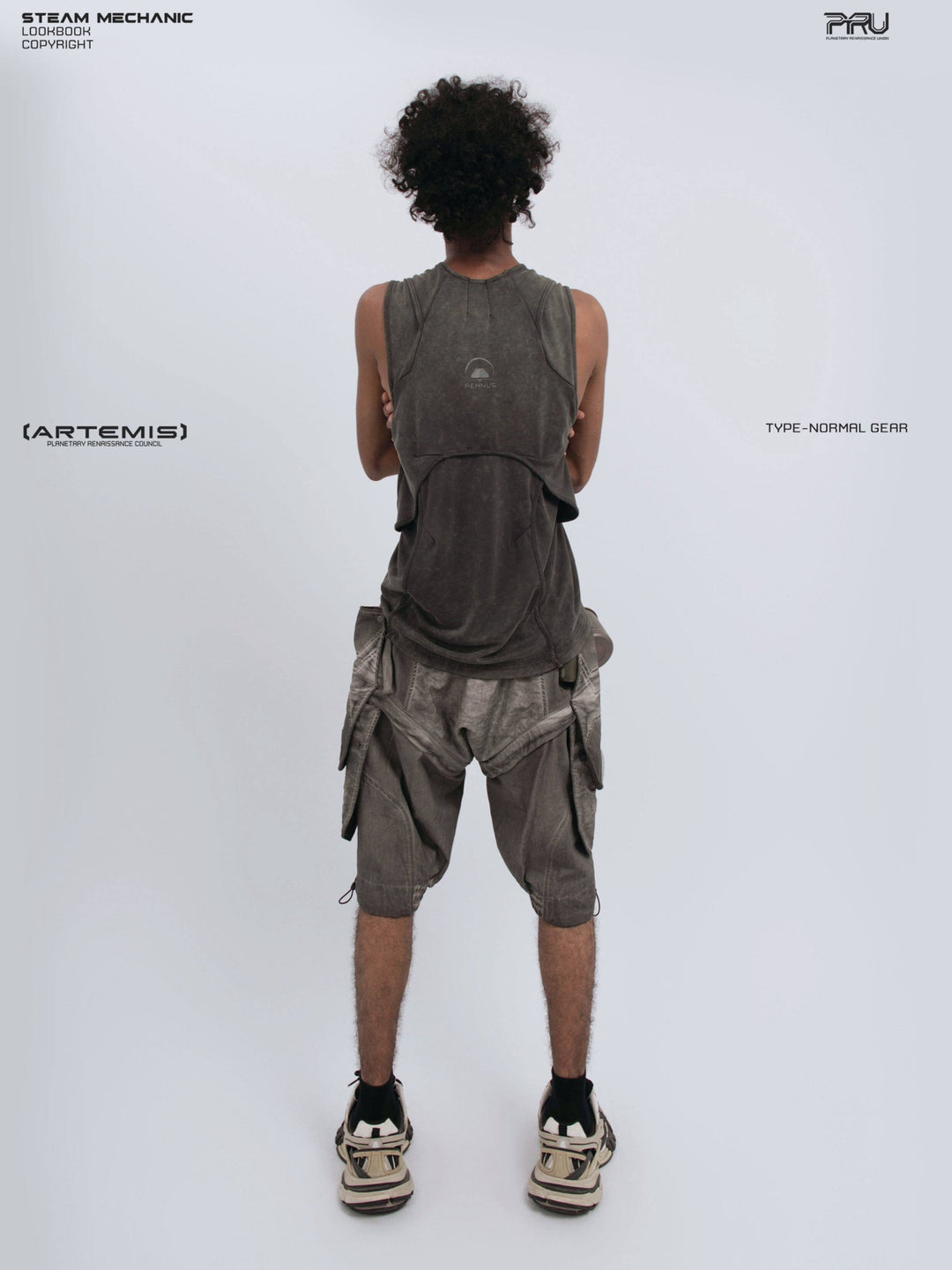 RIFT ARC deconstructed tank in washed gray — straight back modeled view with arms crossed